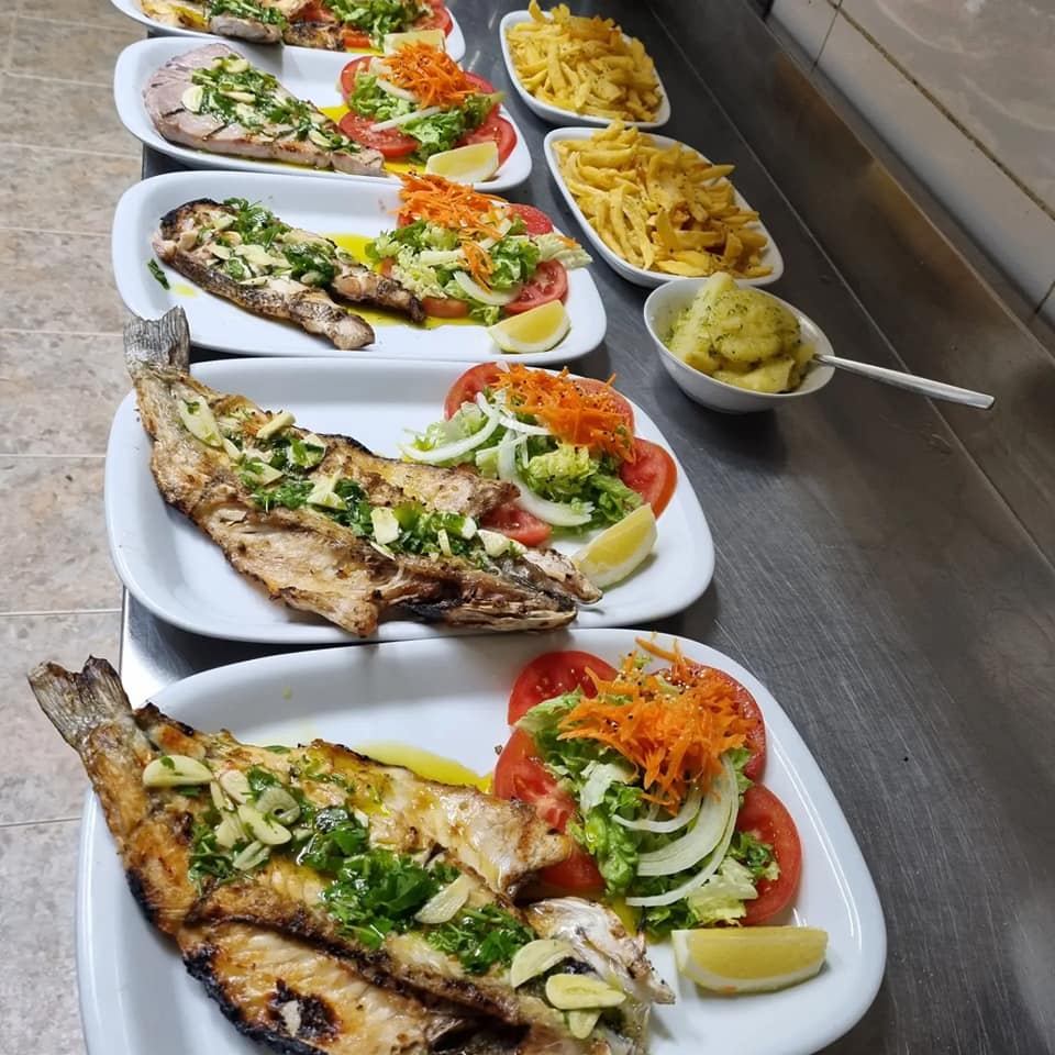 Fresh grilled fish at Tasquinha da Horta Portuguese restaurant in Quarteira